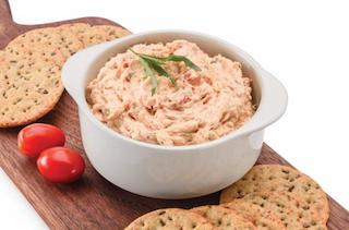 Dip in a white bowl with crackers